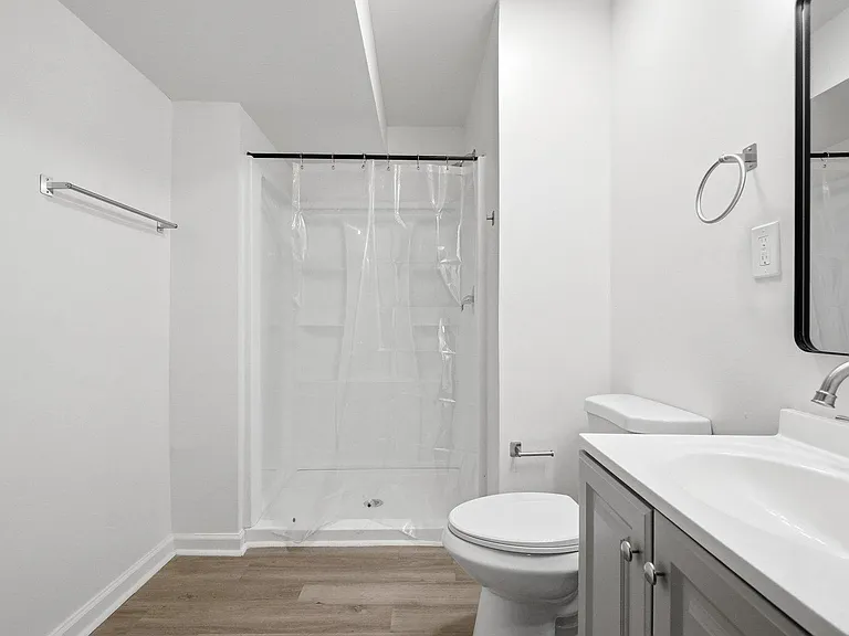 Clean full bath with tub/shower combo, vanity storage, and easy-care flooring for everyday convenience.