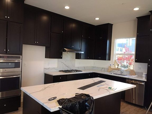 Extended Espresso Cabinets with ivory Quartz Countertops