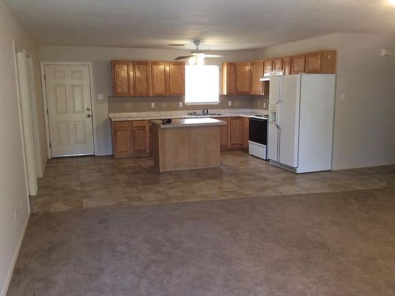 A big open area, the kitchen with beautiful tiles to the liv