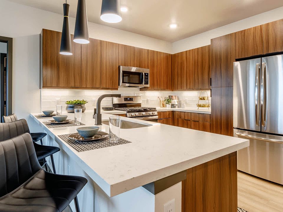 Kitchen with Breakfast Bar and Stainless Steel Appliances