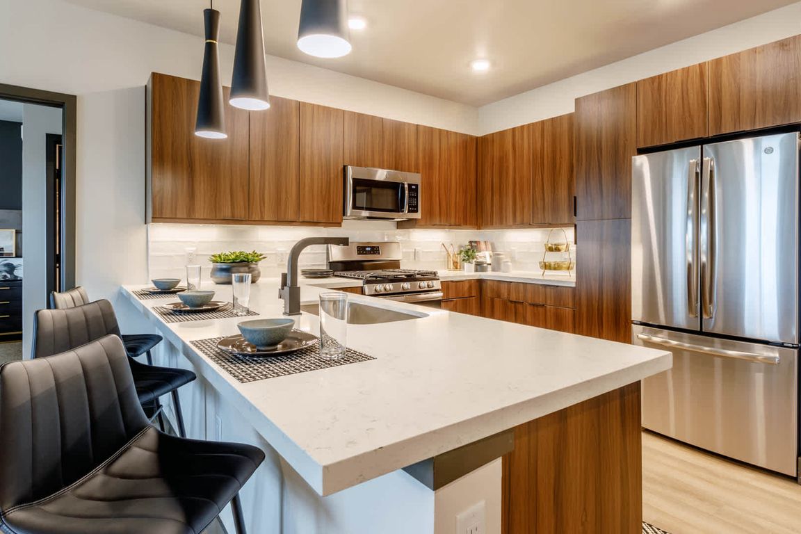 Kitchen with Breakfast Bar and Stainless Steel Appliances
