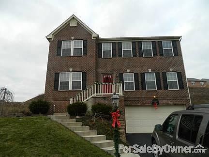 Red brick, Black shutters, large yard to left of house