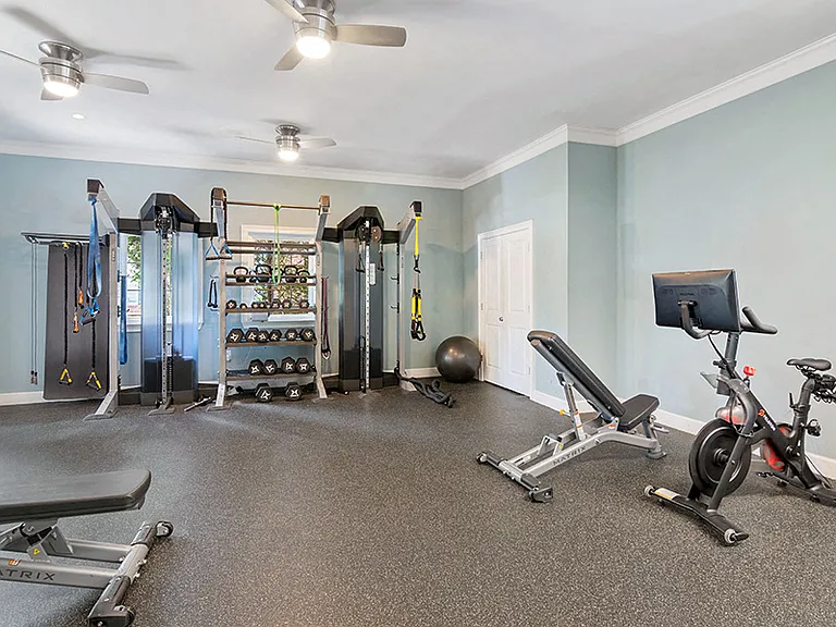 24-hour fitness center with spin bikes and virtual trainer