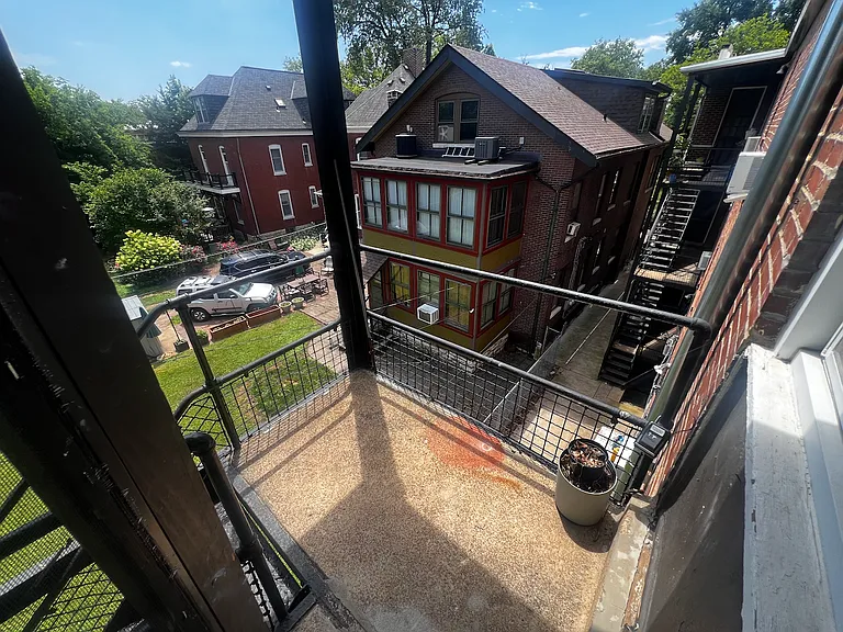 View of fire escape (rear entrance) from kitchen door.