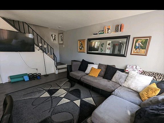 Living room, stairs that lead to bathroom and bedrooms.