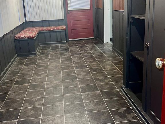 Entrance porch with plenty of storage.