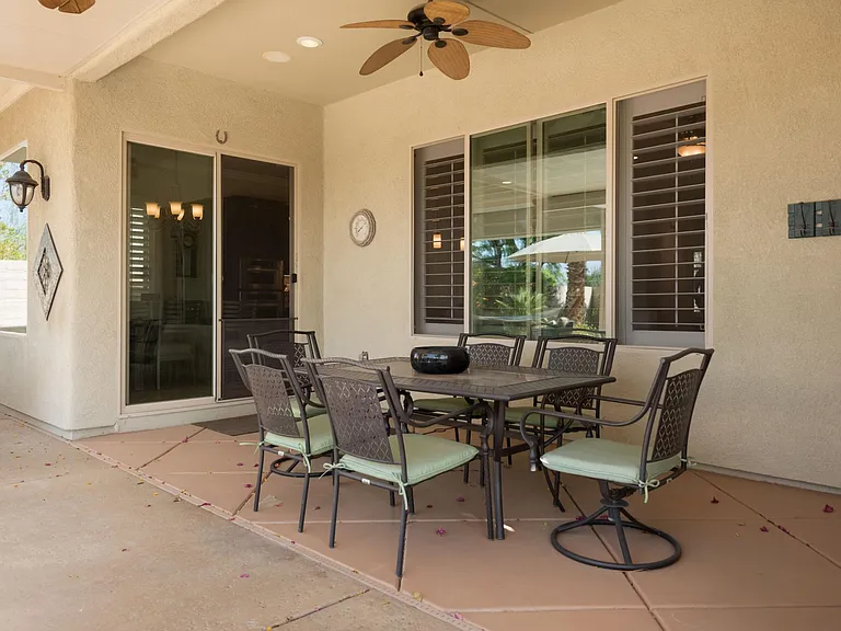Dining alfresco. Breakfast, lunch & dinner under shaded patio with ceiling fans & remote operated powered screens.