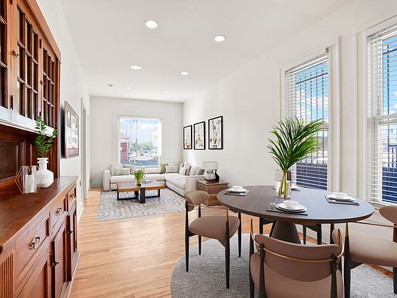 Dining and living room with built in original built in cabinetry