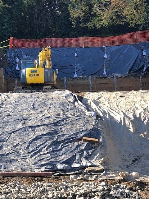 The wall is now approved. an over $200,000 cost paid by seller which included engineering site work, monitoring, and Geotech. The site is ready for foundations! 