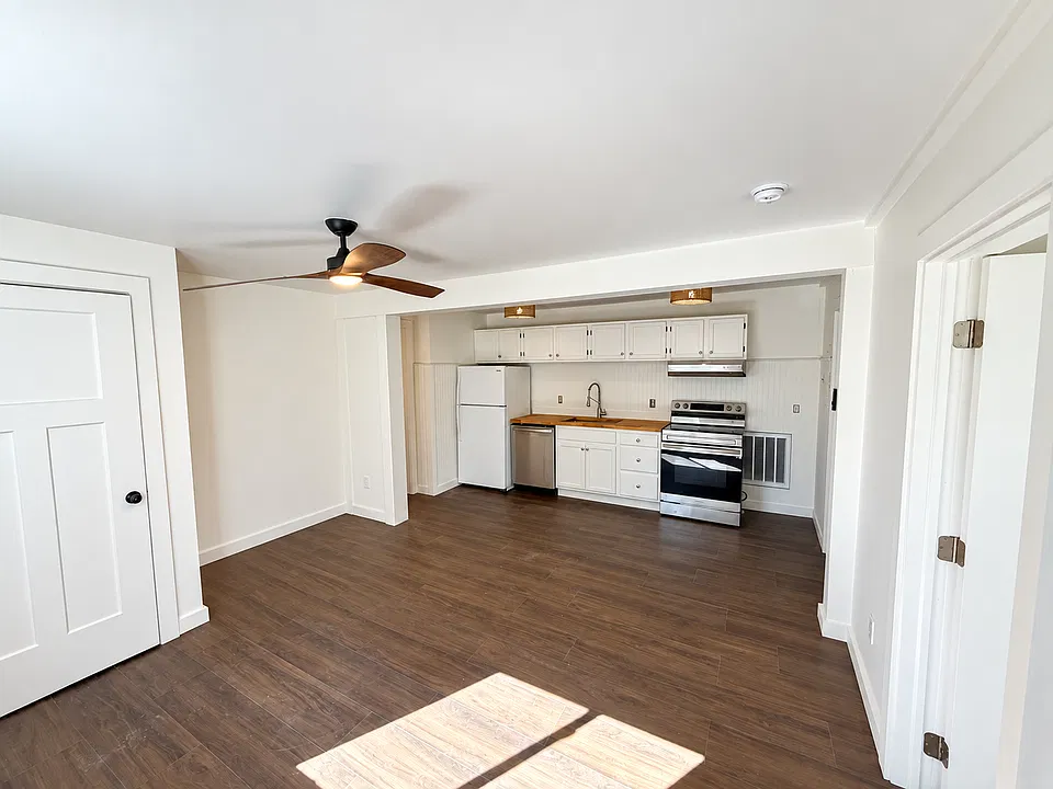 South facing windows provide ample natural light to the open format living room and kitchen.