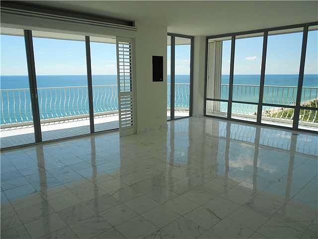 Living Room: Southeast corner with windows everywhere, marb