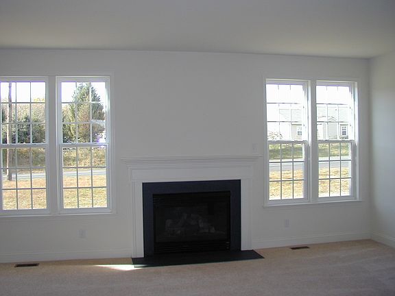 Large family room open to kitchen with gas fireplace