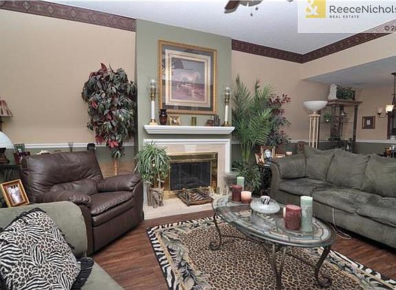 Cozy fireplace at center of living area.