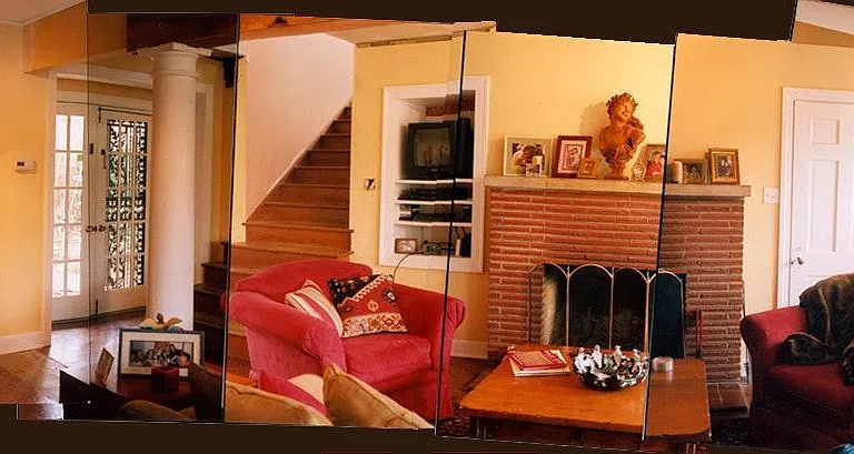 Downstairs Great Room - 20ft x 28ft _ with Wood Burning Fireplace & White Wooden Columns.