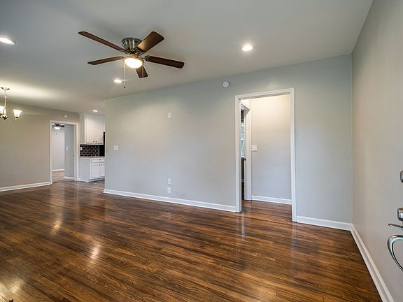 Enjoy the beautiful hardwood floors in the living room, with ceiling fan and canned lighting.