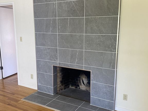 Newly refaced wood burning fireplace