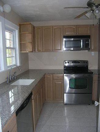 Kitchen with granite countertops and stainless steel applian