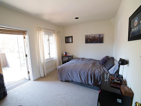 Master bedroom with french door to balcony, window, and 2 closets (one with W/D, not in picture)