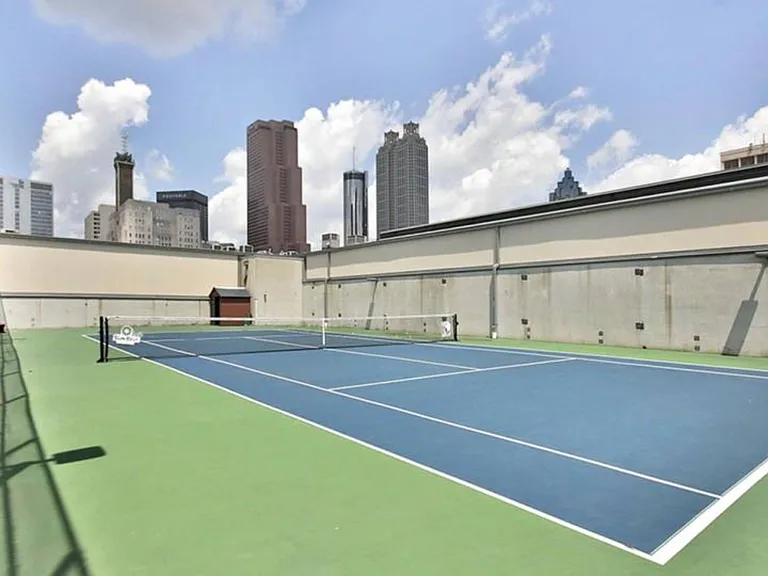 Rooftop tennis court with downtown skyline views
