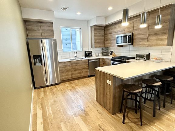 Spacious and modern kitchen with all new appliances and plenty of storage space.