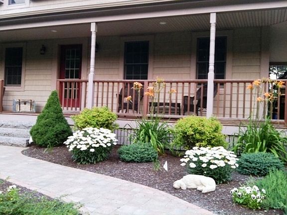 Farmers porch with mahogany deck, paver walkway &amp; granite stairs