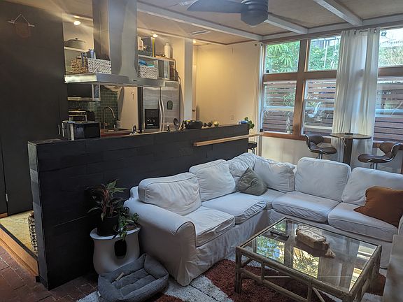 Living room/kitchen (with different furniture from other photo).