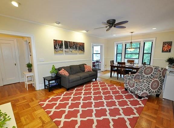 Large Living Room overlooking Garth Woods and the buildings patio.  The living room has recess lighting, chair rail and refinished parquet floors.  The room is 23'-0" x 14'-0".