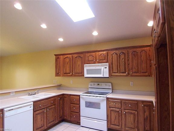 Great kitchen with a snack bar.  Measures 13 x 12 with a skylight for extra lighting.