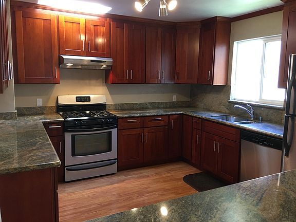 Renovated Kitchen with Cherry Wood Cabinets