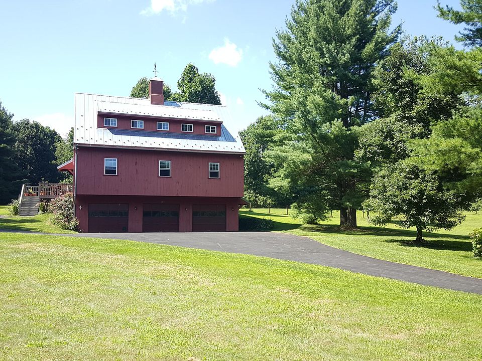 Front view of barn. Apartment is on third level. Parking and private deck on left side