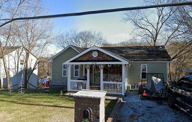 Front view: Beautiful Porch, Large Front Yard, 2-Car Driveway