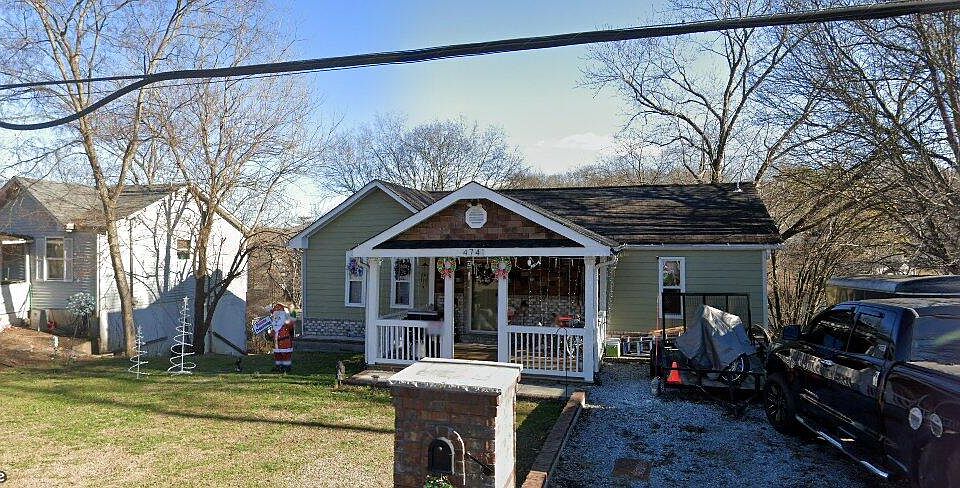 Front view: Beautiful Porch, Large Front Yard, 2-Car Driveway