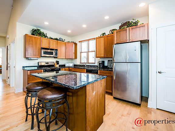 Steel & granite kitchen with island.