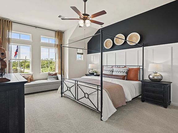 Primary suite with sloped ceiling