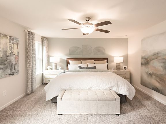 Unwind in the private primary suite, located upstairs.