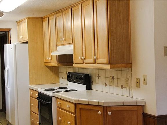 Kitchen with lots of storage.  Refrigerator stays with house.