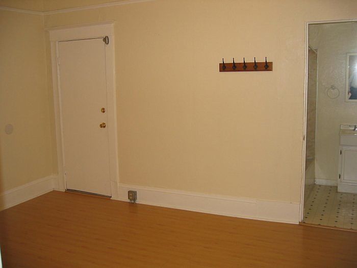 Bedroom with wood floors