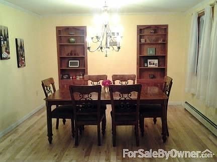 Kitchen
						:
						Cherry cabinets, stainless steel appliances, and hardwood floors
