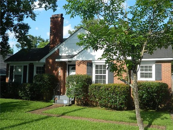 Great curb appeal, and a brick sidewalk to the front door.