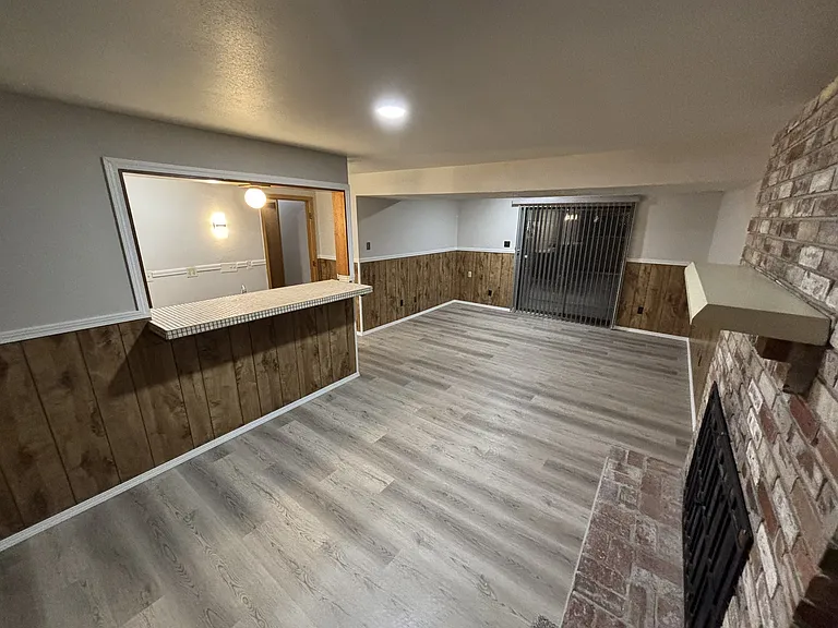 Massive downstairs family room with retro fireplace and wet bar, great for entertaining!
