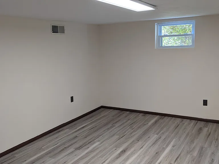 Third bedroom located in the basement. Window view.