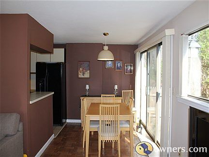 Dining Room with 3 Sliders to Patio