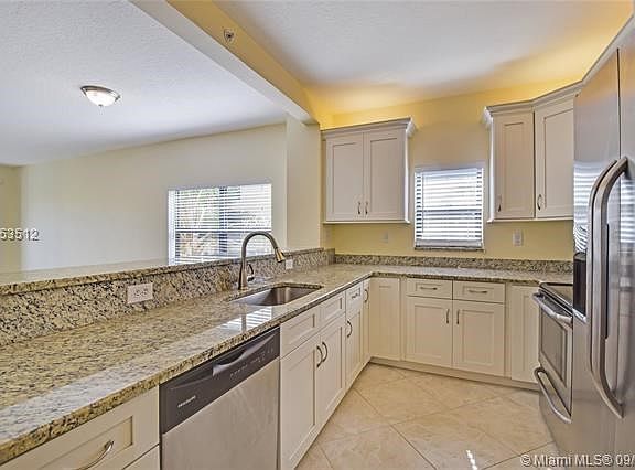 Light & Bright End Unit with New Kitchen, Baths & more!