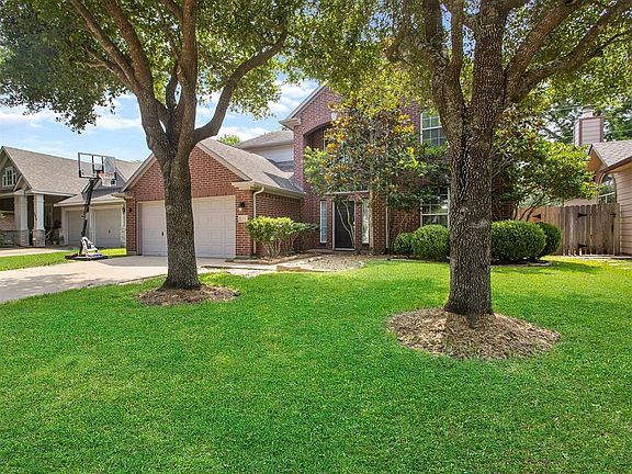Another view of this home with handsome brick elevation. A double wide driveway leads to the 2 car garage and allows for plenty of off street parking for homeowners and guests.