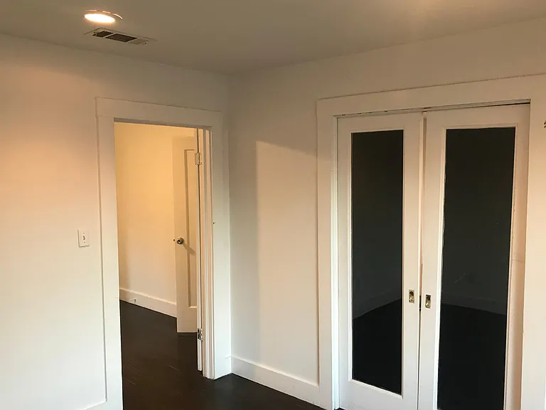 Study from left corner of room pocket doors to living room
