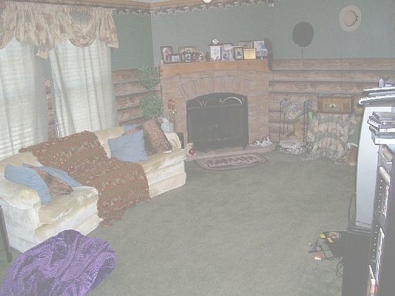 LARGE LIVINGROOM WITH WOOD BURNING FIREPLACE