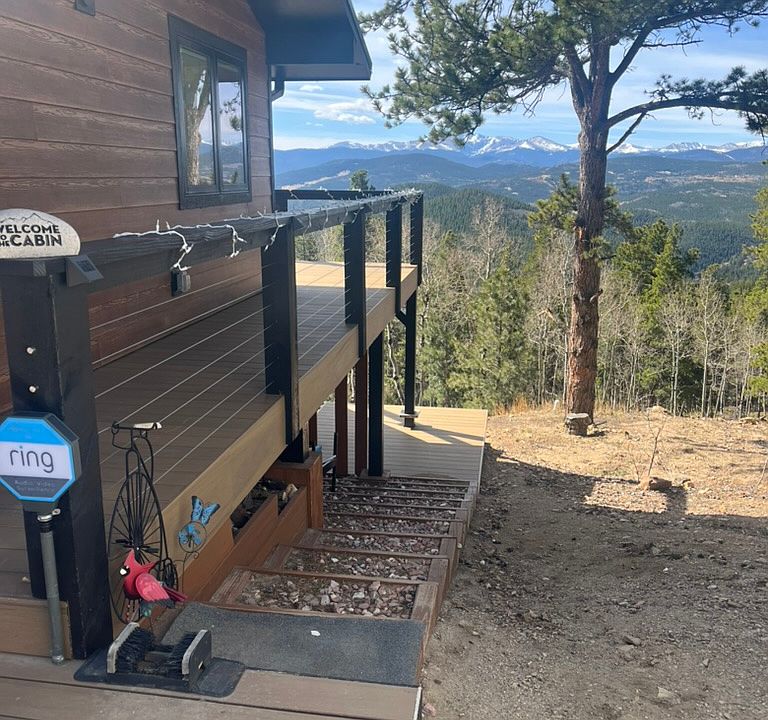 Side stairs to deck and private entry. Did you see the view?