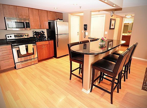 Bar height table comfortably sits six.