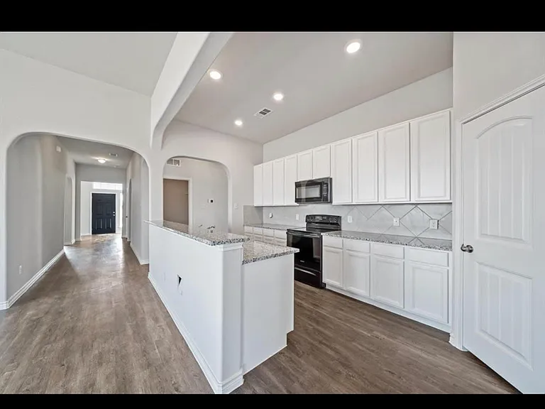View from galley kitchen to the entryway