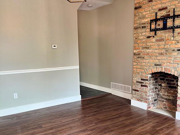 exposed brick and hardwood floors in your living room